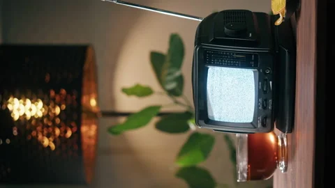 Vertical video of small old television with grey interference screen on home Stock Footage 169116375
