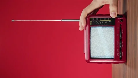 Vertical video of small old television with grey interference screen on yellow Stock Footage 172270820