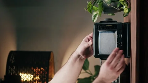 Vertical video of small old television with grey interference screen on home Stock Footage 195530331