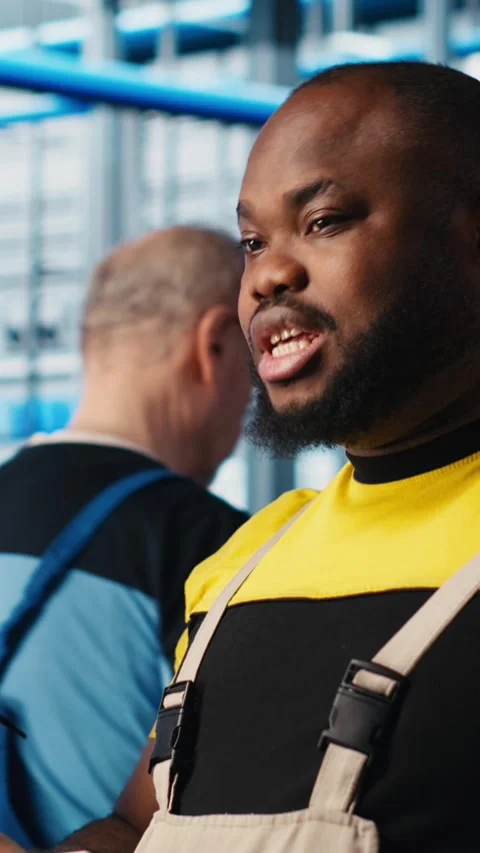 Vertical video Smart factory engineering team brainstorming, testing automated Stock Footage 306066175