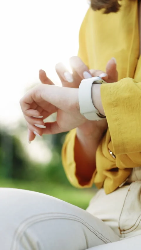 Vertical Video of Smart watch on woman's hand outdoor. Girl using smartwatches Stock Footage 305331565