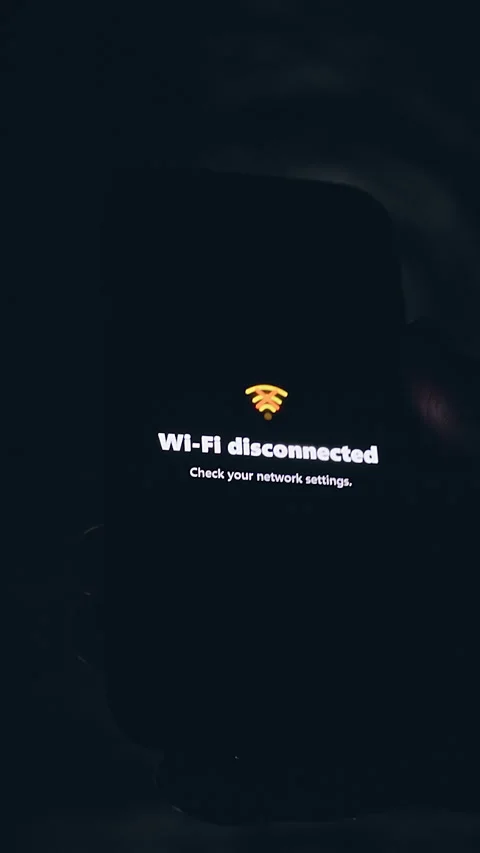 Vertical video. Smartphone Displaying WiFi Disconnected Error Inside Dark Underg Stock Footage 335205517