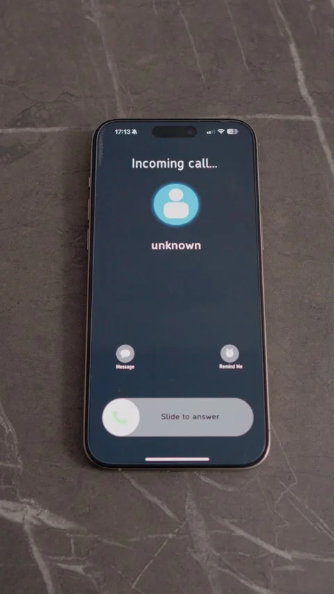 Vertical video Smartphone shows incoming call from Unknown number while on table Stock Footage 346715564