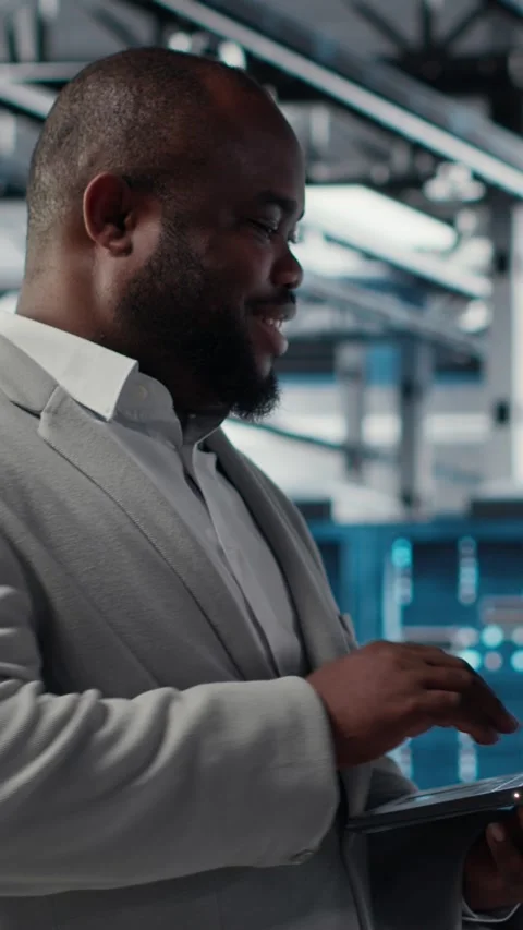 Vertical video Smiling data center programmer using laptop to upgrade system Stock Footage 311415561