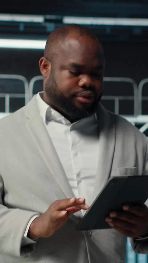 Vertical video Smiling data center technician installing server racks systems Stock Footage 311550087