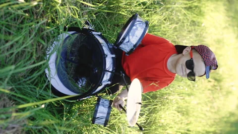 Vertical video of smiling drummer boy beat drumstick in hard rock music. Young Video stock 248204246