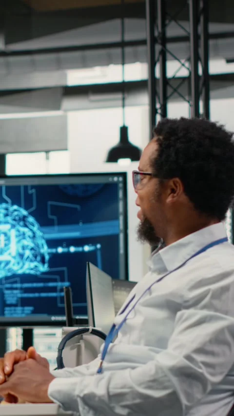 Vertical video Smiling programmers working in AI startup train predictive models Stock Footage 323142405