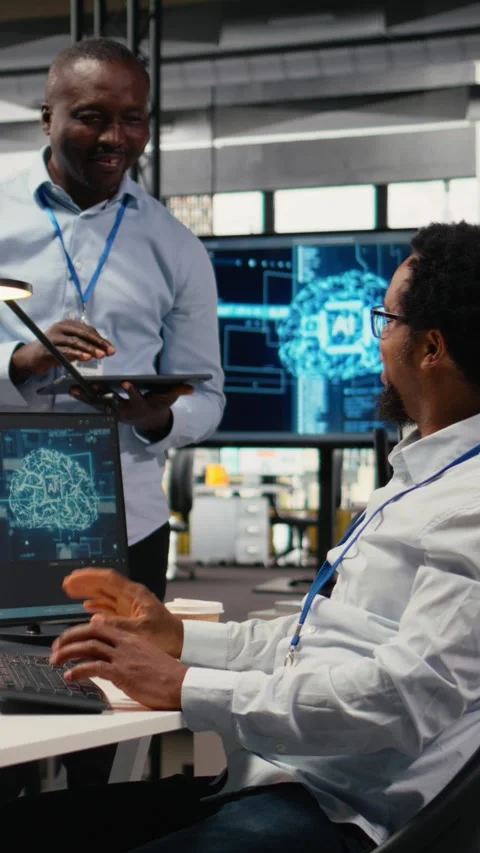 Vertical video Smiling programmers working in AI startup train predictive models Stock Footage 323236590