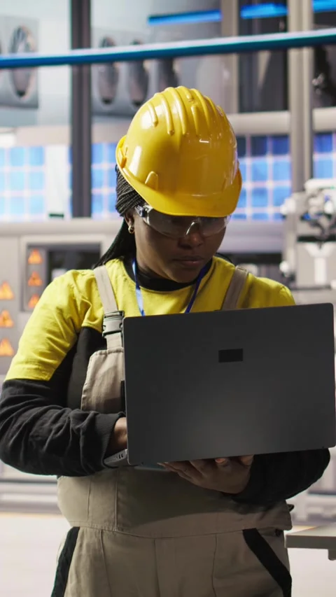 Vertical video Smiling smart factory specialist testing automated systems to Stock Footage 307068149