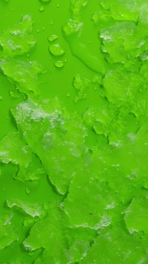 Vertical video of Snow melts fast in green screen background Spring Time lapse Stock Footage 237251365