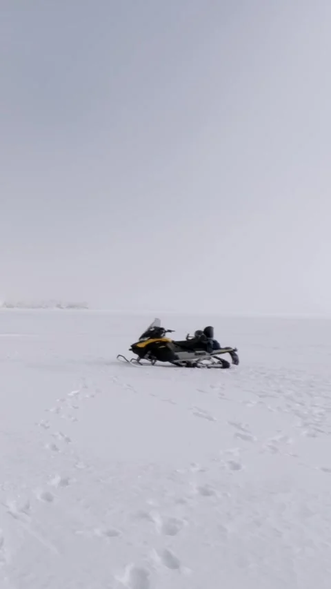 Vertical Video of Snowmobile on Arctic Sea Ice, Svalbard Stock Footage 340036280