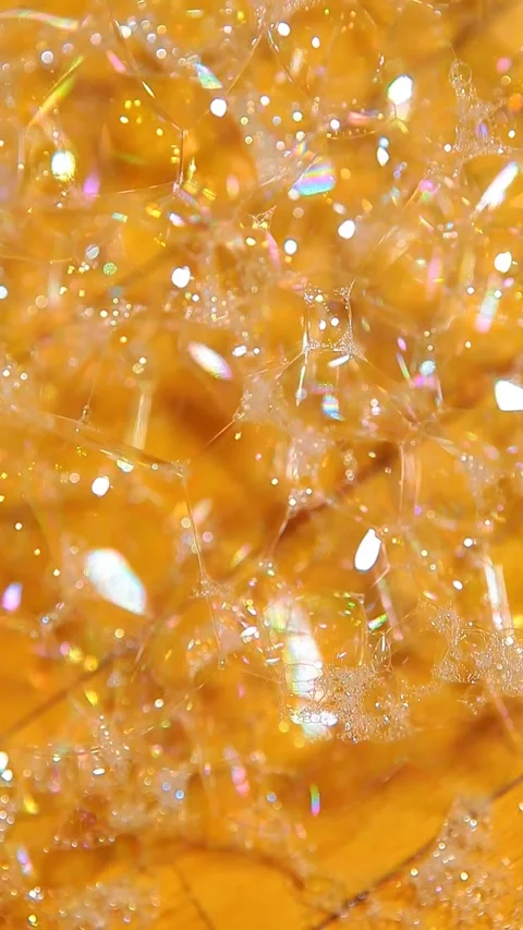 Vertical video of soap bubbles gold bokeh Stock Footage 246484934