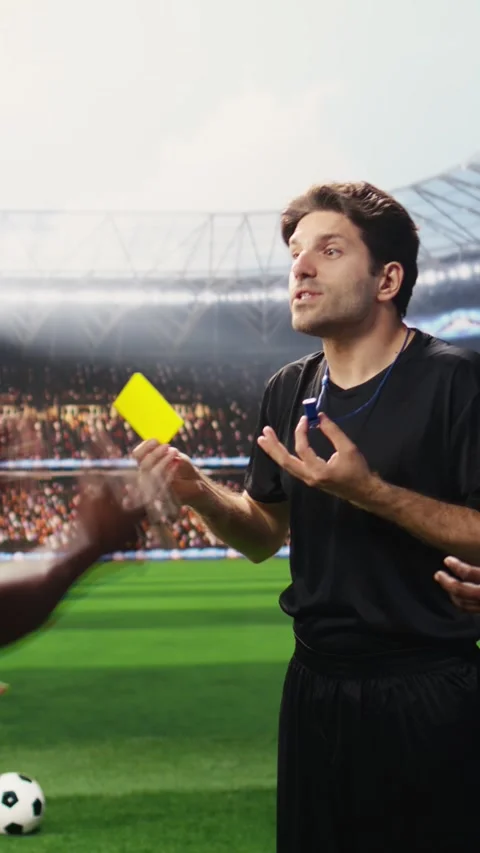 Vertical Video Soccer referee showing yellow card to angry player protesting Stock Footage 338046839