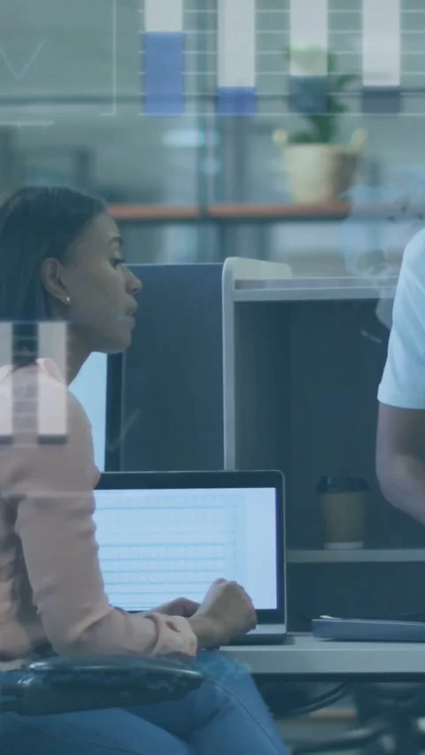 Vertical video: Software dev pointing at laptop, guiding man, typing and causing Stock Footage 334396628