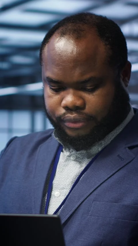 Vertical video Software developer in data center runs system diagnostic tests on Stock Footage 277853700