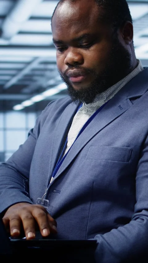 Vertical video Software developer in data center runs system diagnostic tests on Stock Footage 277854648