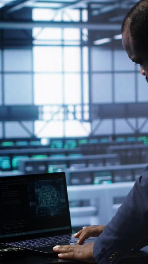 Vertical video Software developer in data center using artificial intelligence Stock Footage 277857359