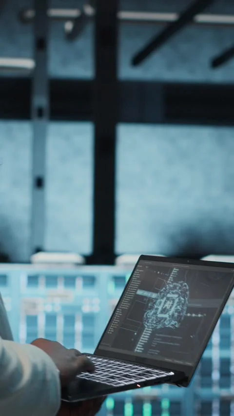 Vertical video Software developer in data center using artificial intelligence Stock Footage 311489177