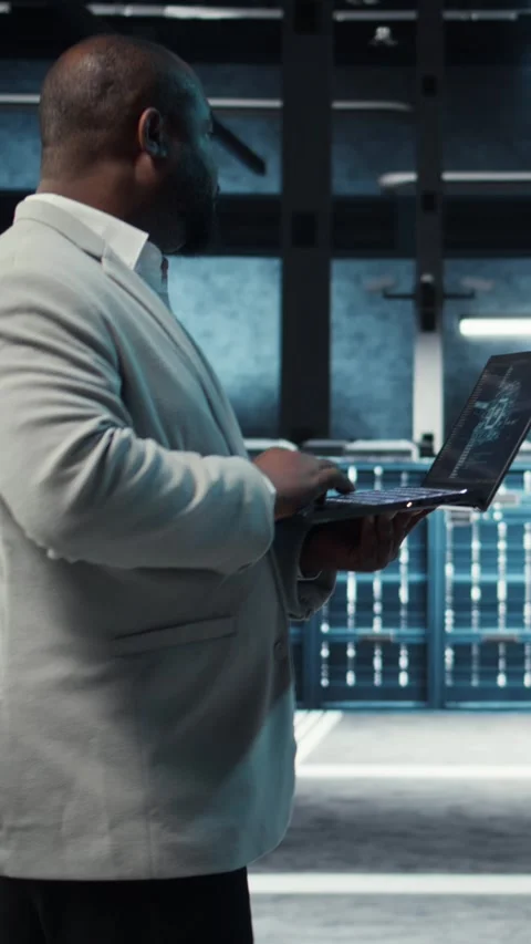 Vertical video Software developer in data center using artificial intelligence Stock Footage 311991904