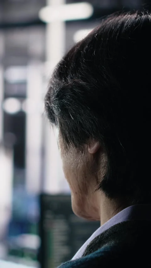 Vertical video Software developer in data center coding with generative AI Stock Footage 313507871