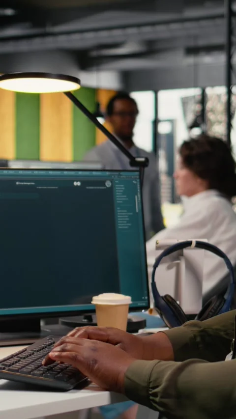 Vertical video Software developer in office solving tasks with AI LLM chatbot Stock Footage 323236802