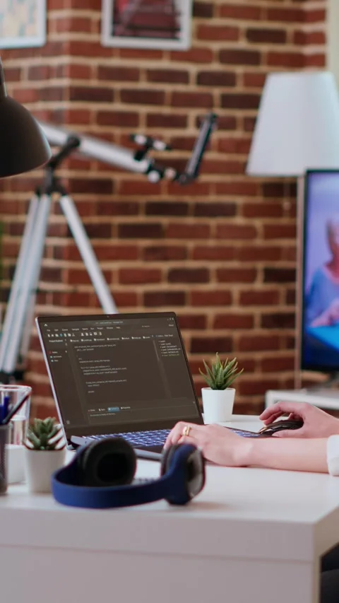 Vertical Video Software developer types programming code in a cozy home office Stock Footage 319468314