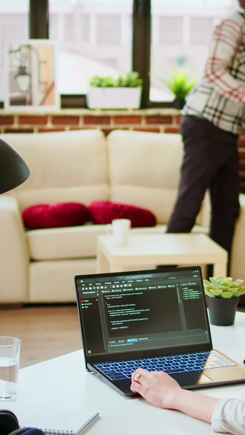 Vertical Video Software developer types programming code in a cozy home office Stock Footage 319468830