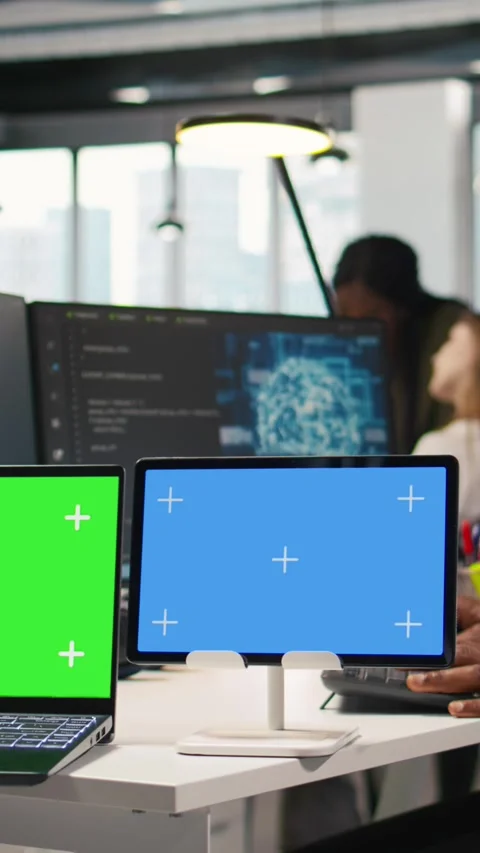 Vertical video Software developer using AI on isolated screen laptop and tablet Stock Footage 312768423