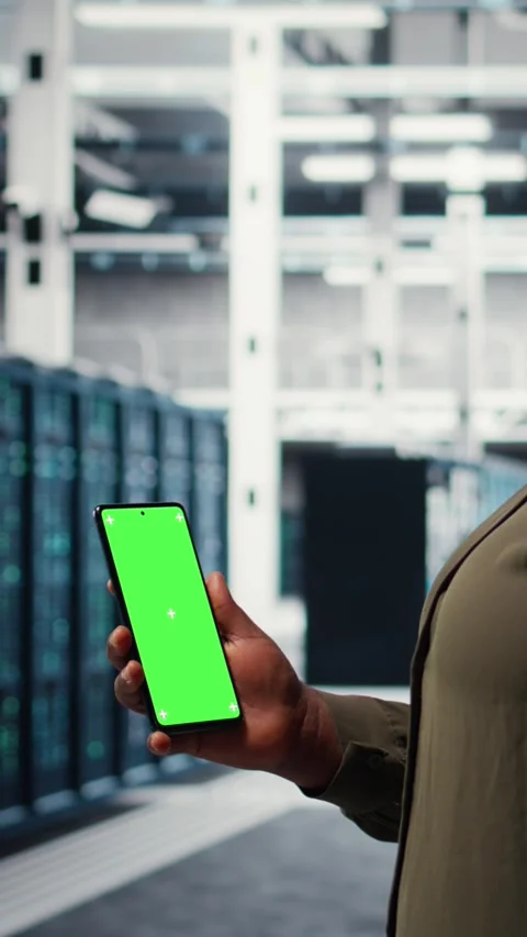 Vertical video Software developer using app on mockup phone to do server hub Stock Footage 316858026