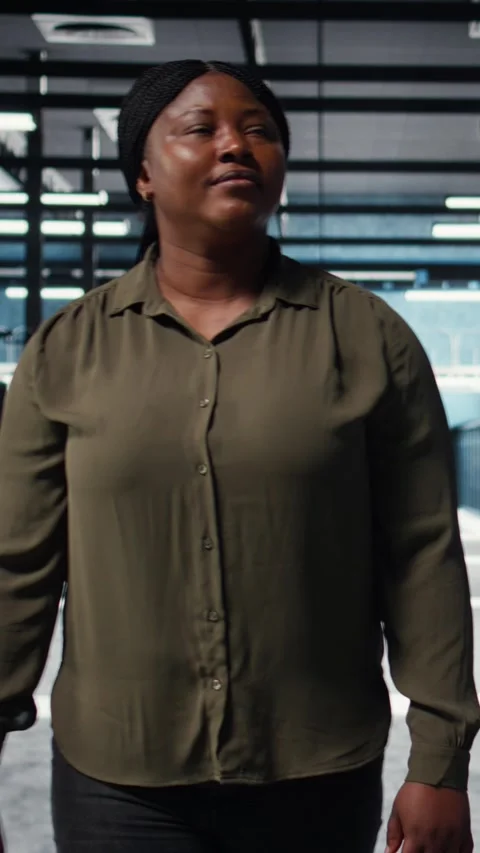 Vertical video Software developer walking in data center, checking hardware Video stock 316860015