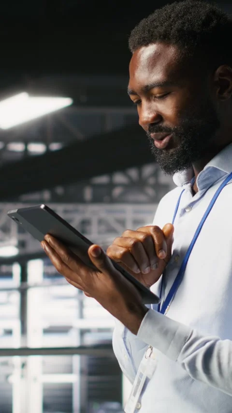 Vertical video Software developers on data center industrial platform analyzing Stock Footage 310777980