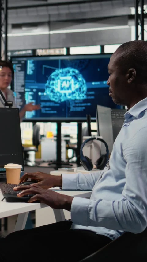 Vertical video Software developers in startup office work with artificial Stock Footage 323330412