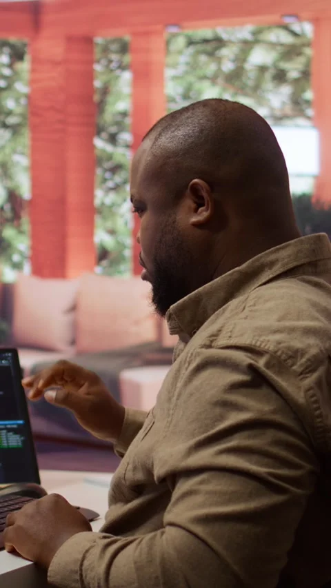 Vertical Video Software engineer coding on a laptop focusing on deep learning Stock Footage 278375953