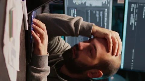 Vertical video: Software engineer yawning and falling asleep on desk Stock-Footage 222213867