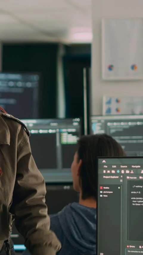 Vertical video: Software engineers analyzing source code and database Stock Footage 218574979