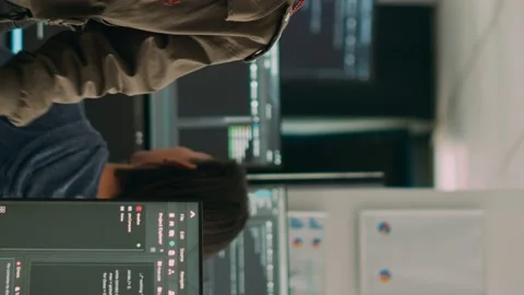 Vertical video: Software engineers analyzing source code and database Stock Footage 219701776