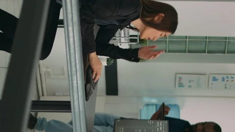 Vertical video: Software programer feeling stressed about writing code in front Stock Footage 219701871