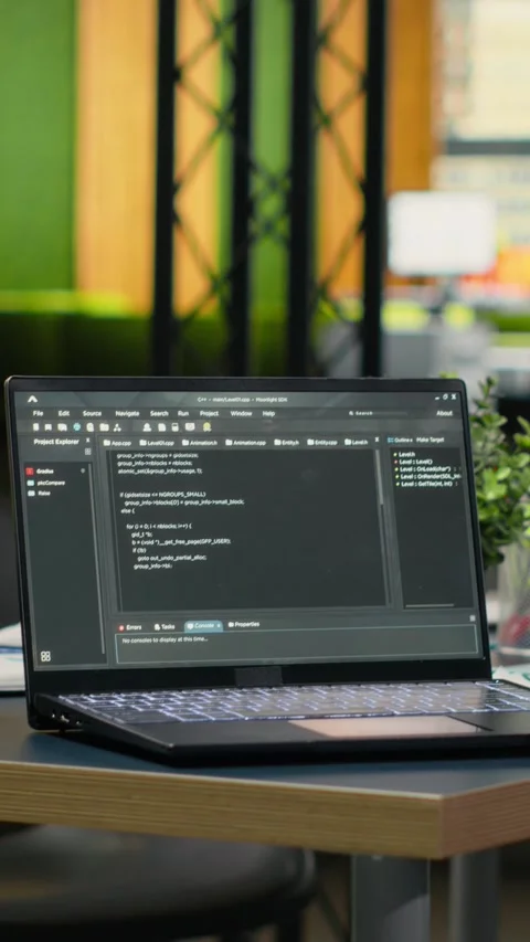 Vertical video Software running on laptop in empty office to accelerate Stock Footage 323329981