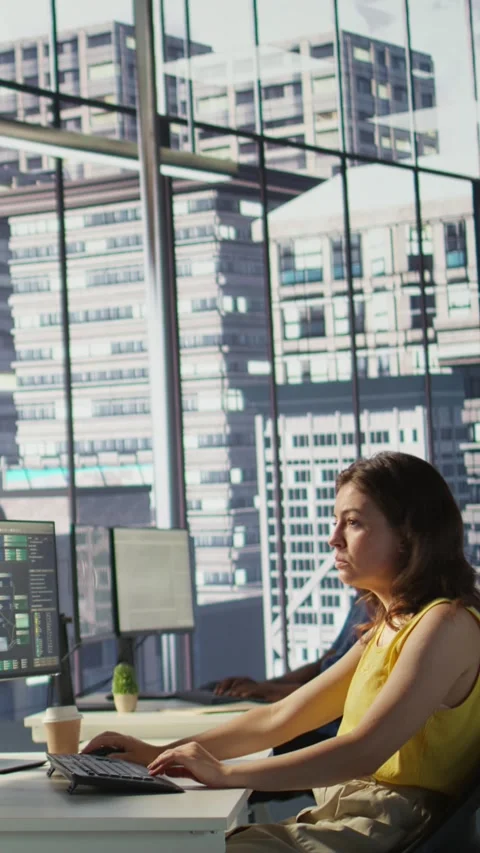 Vertical video Software technician developing and maintaining databases at work Stock Footage 319486682