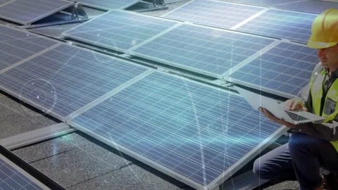 Vertical video: Solar tech kneeling laptop arrival testing with light glow on Stock Footage 333963253