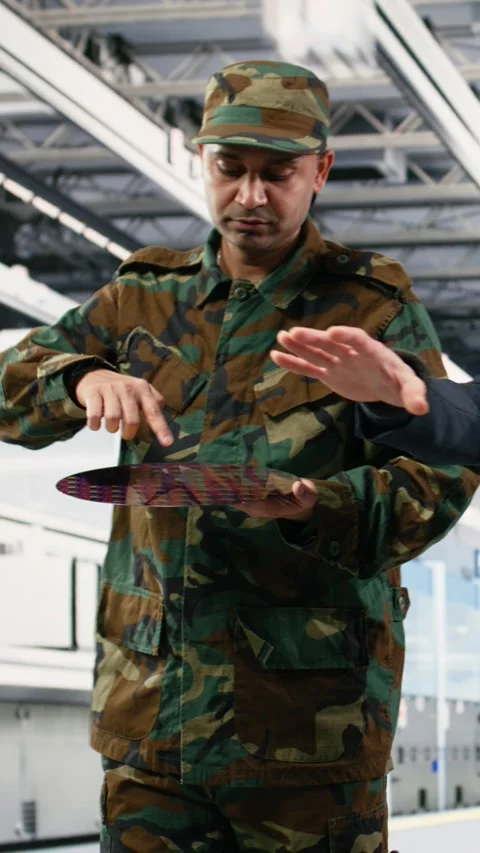 Vertical video Soldier and engineer in microchip factory increase semiconductor Stock Footage 333615309