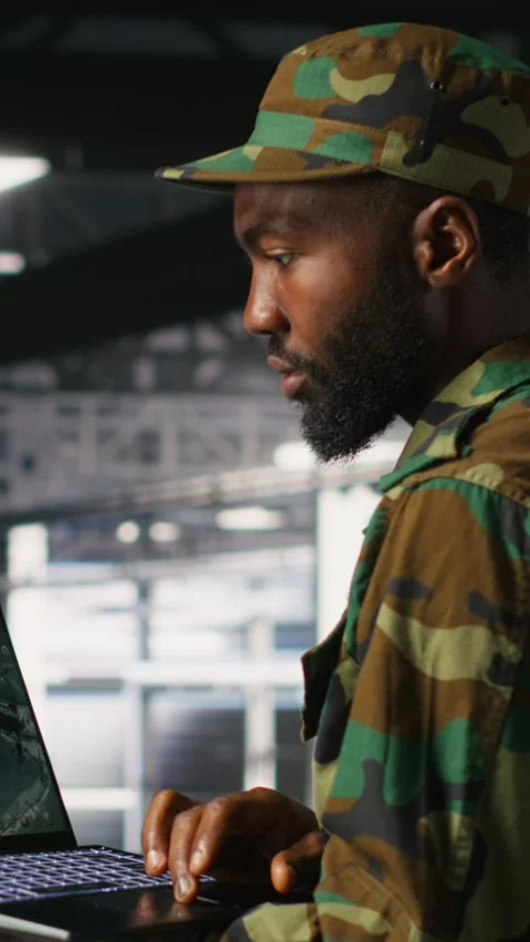 Vertical video Soldier in server room uses geospatial data to support emergency Stock Footage 310779576