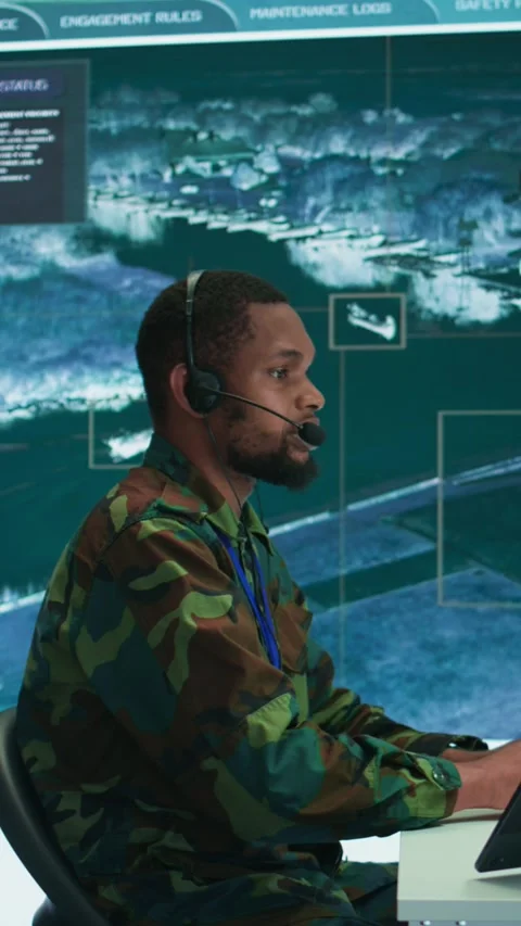 Vertical Video Soldiers in a modern command center analyze live data from cctv Stock Footage 280012780
