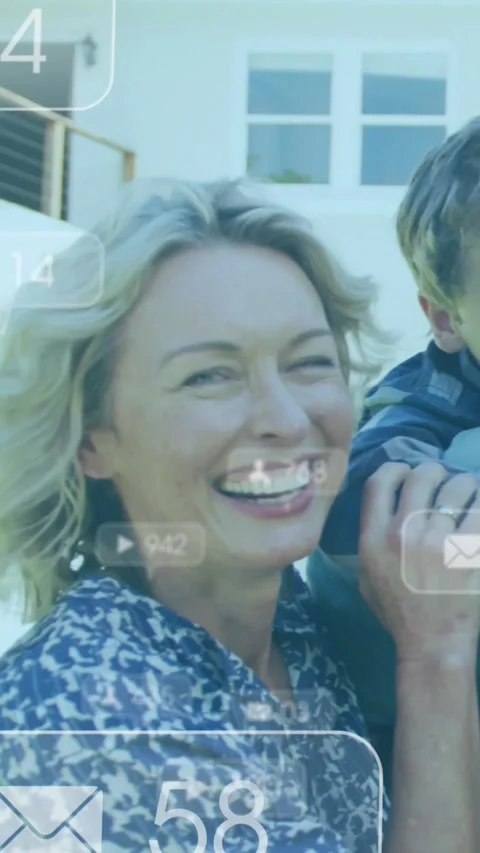 Vertical video: Son climbing onto shoulder, mom steadying son to smile, social Stock Footage 333953092
