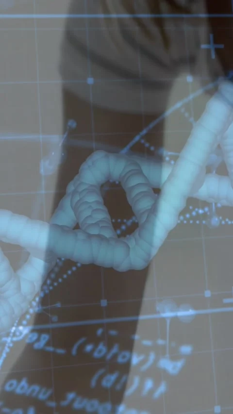 Vertical video: Son typing keys, initiating DNA code overlays, mother leaning, Stock Footage 332334838