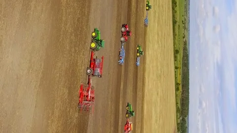 Vertical video. Sowing field and all kinds of tractor work Stock-Footage 210159797