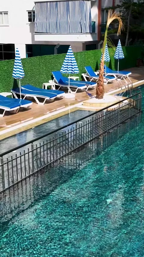 Vertical Video: Spacious Pool with Clear Azure Water in a New Residential Video stock 297719865