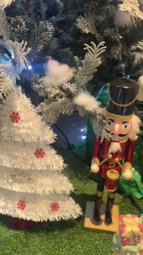 Vertical video of sparkling snowman under frosted christmas tree Stock Footage 324416669
