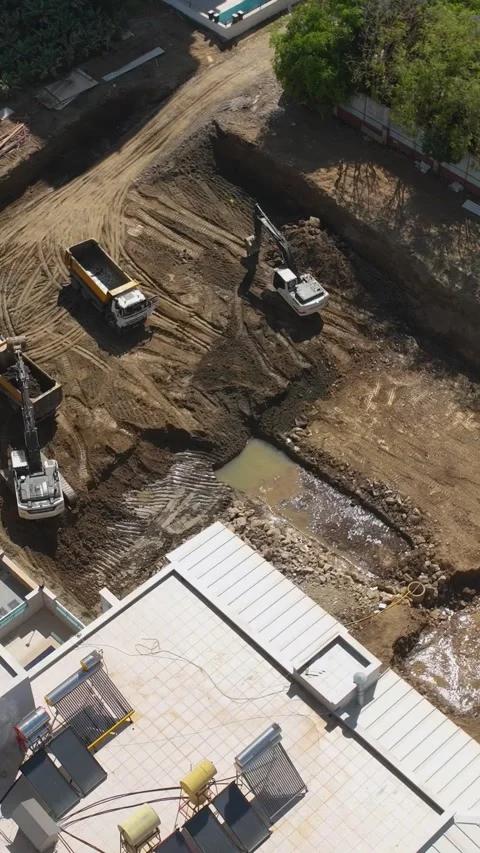 Vertical Video: Specialists and Machinery Working on Welding and Earthwork Stock Footage 344322713