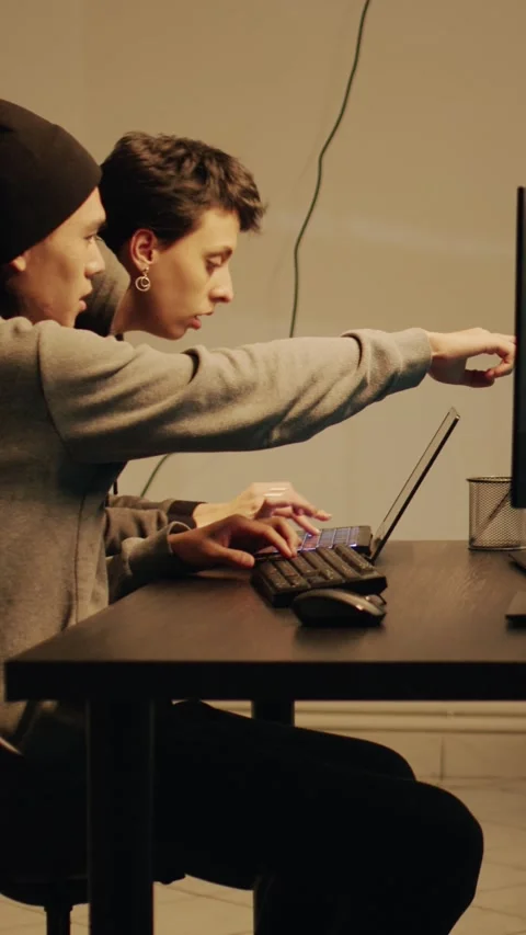 Vertical video: Spies team committing cryptojacking and cyberwarfare Video stock 227667253
